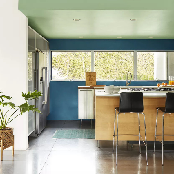 A bright kitchen with walls and ceiling painted in Benjamin Moore Affinity Collection colors