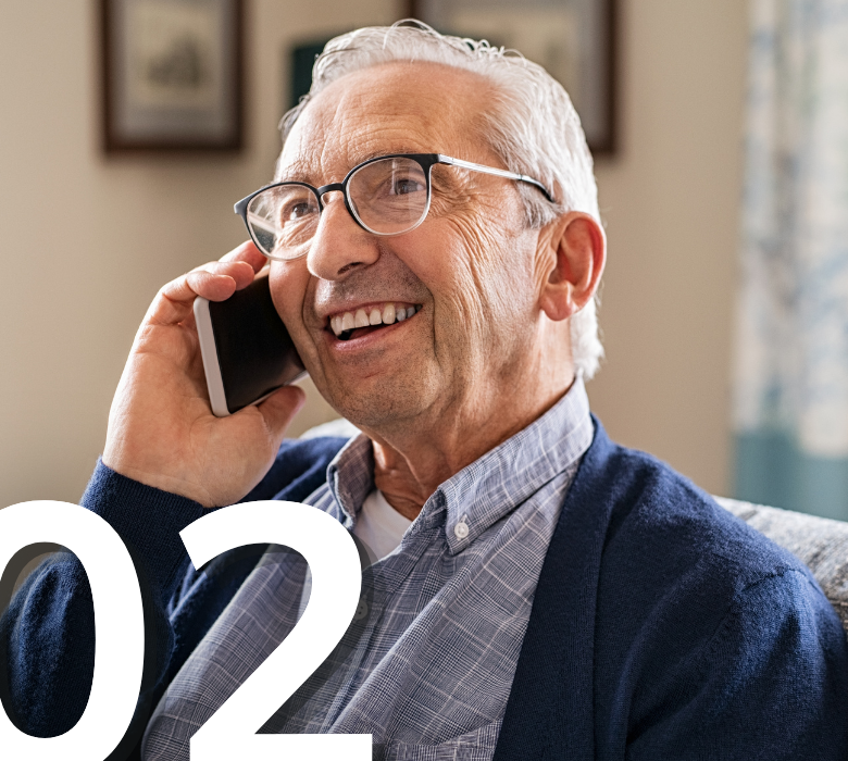 A happy elderly man smiling while talking on his cell phone