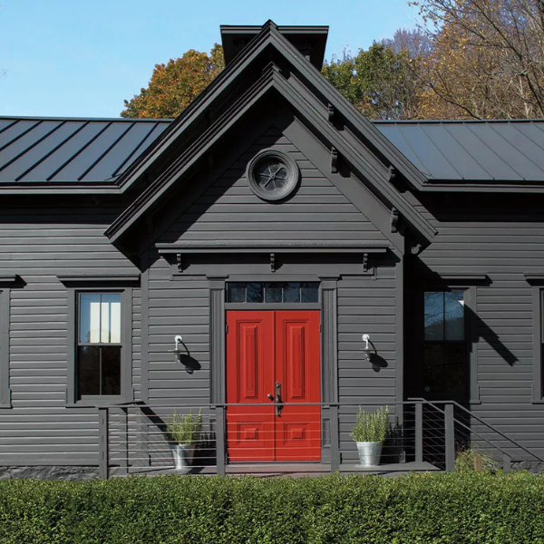 Classic home exterior and red front door painted in Benjamin Moore Williamsburg Color Collection colors