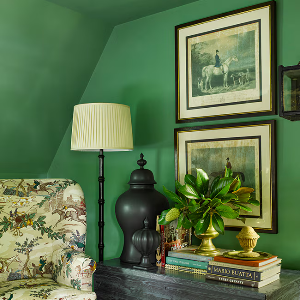 A classy room with old-fashioned furniture, featuring bold green walls and ceiling painted in a Benjamin Moore Williamsburg Color Collection shade